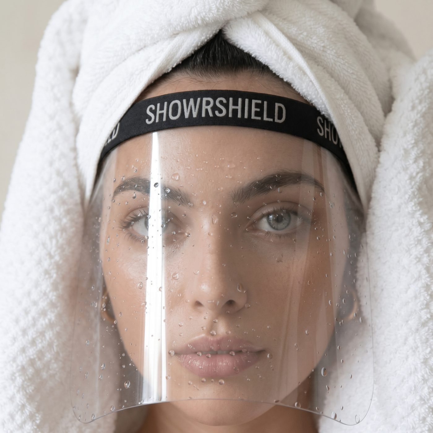 Editorial portrait of a woman wearing SHOWRSHIELD with a towel wrap